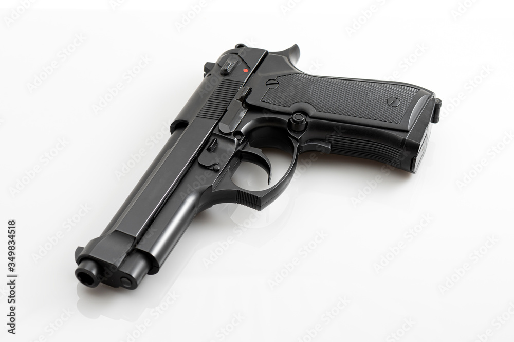 Black pistol gun isolated on the white background. Black pistol gun isolated on the white background.