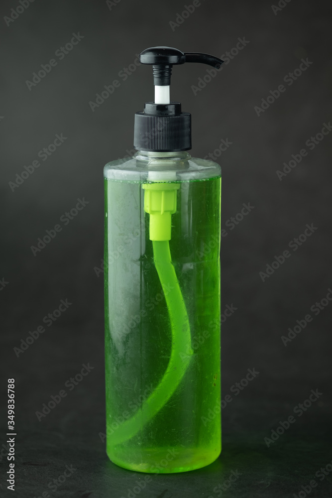 Dishwashing liquid in a clear plastic pump bottle. Dishwashing liquid in a clear plastic pump bottle.