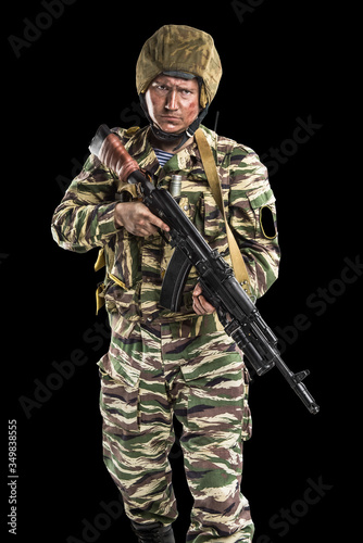 Male in uniform conforms to Russian army special forces (OMON) in War in Chechnya. Isolated on black backgroundx