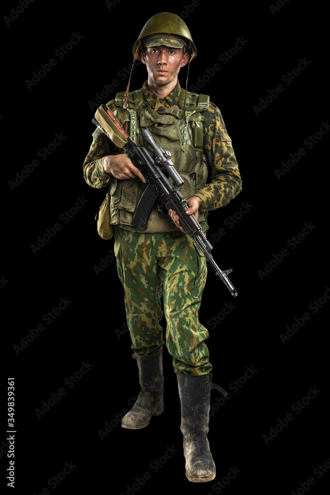 Male in uniform conforms to Russian army special forces (OMON) in War in Chechnya. Isolated on black backgroundx Male in uniform conforms to Russian army special forces (OMON) in War in Chechnya. Isolated on black backgroundx
