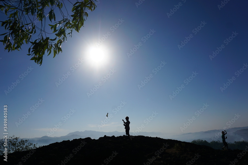 Silhouette of a man on a mountain
