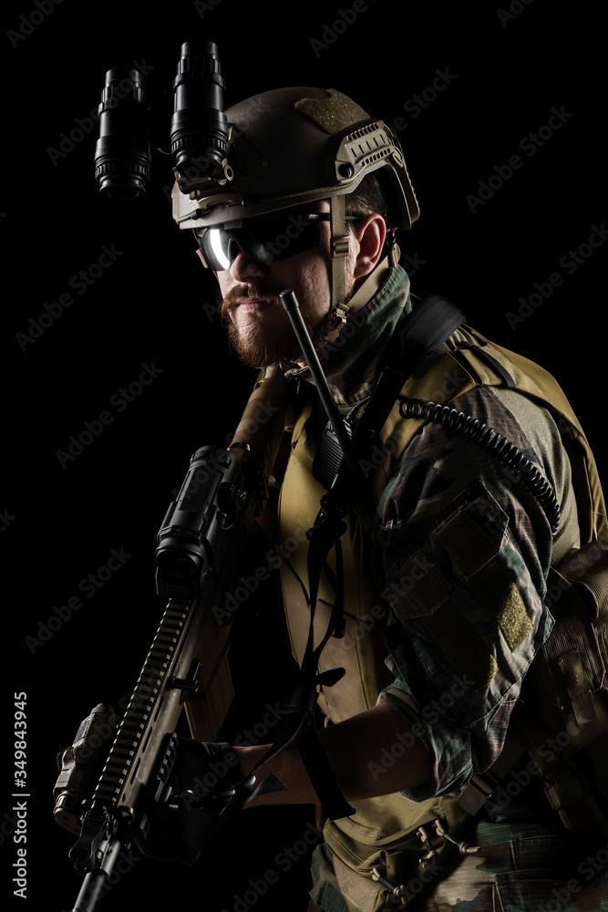 US marine corps soldier with weapon. Shot in studio. isolated with clipping on black background.