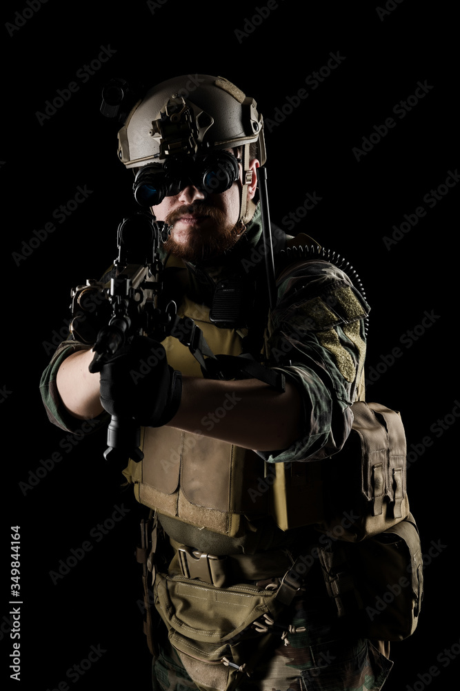 US marine corps soldier with weapon. Shot in studio. isolated with clipping on black background.