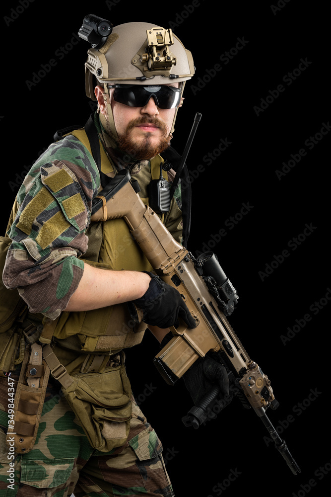 US marine corps soldier with weapon. Shot in studio. isolated with clipping on black background. US marine corps soldier with weapon. Shot in studio. isolated with clipping on black background.