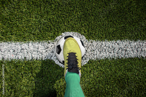 Top view of a soccer player standing on the center of soccer fieldfield photo