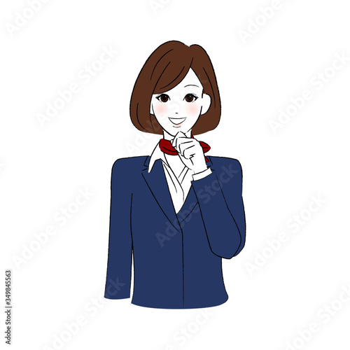 あごに手をあてて微笑む制服を着た女性