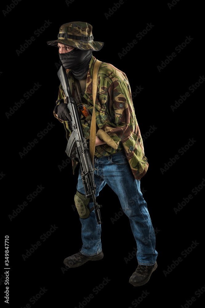 post-apocalyptic soldier. style of dress from 90's. shot in studio. isolated with clipping path on black background post-apocalyptic soldier. style of dress from 90's. shot in studio. isolated with clipping path on black background