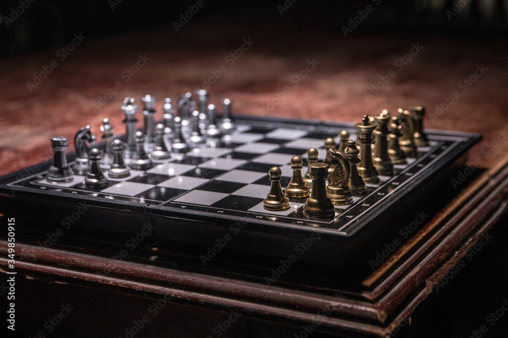 Chess figures on a dark background with smoke and fog. Selective focus Chess figures on a dark background with smoke and fog. Selective focus