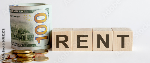 Business Concept with wooden blocks Rent with money. Growing business startup concepts.