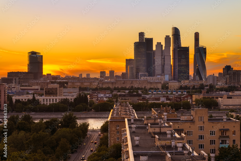 MOSCOW, RUSSIA - JULY 13, 2016: Skyscrapers of Moscow City international business centre on sunset. View from novodevichy park.