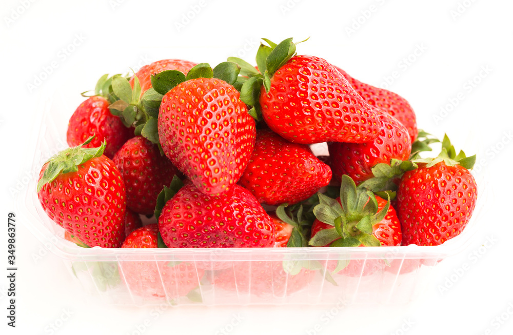 fresh appetizing strawberries in a plastic tray onwhite background fresh appetizing strawberries in a plastic tray onwhite background