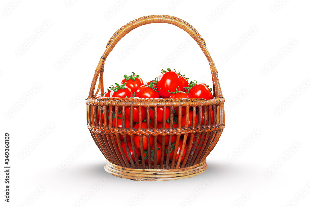 Fresh tomatoes in basket isolated on white background.