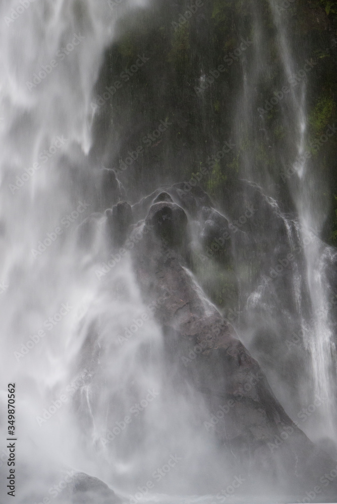 Waterfall with long exposure over rocks with mist