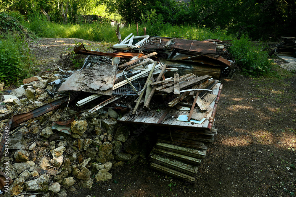 Wild discharge. Debris and rubbish. Heaps of scrap metal, and steel thrown into the wild. Household garbage abandoned in the wild. Environmental problem concept with pollution. Wild discharge. Debris and rubbish. Heaps of scrap metal, and steel thrown into the wild. Household garbage abandoned in the wild. Environmental problem concept with pollution.