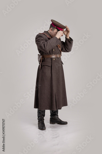Actor man in an old military uniform of an officer of the Soviet army during the World War II photo