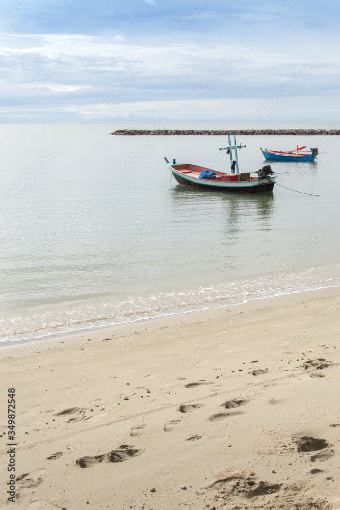 Fototapeta premium Small fishing boat mooring at the beach.