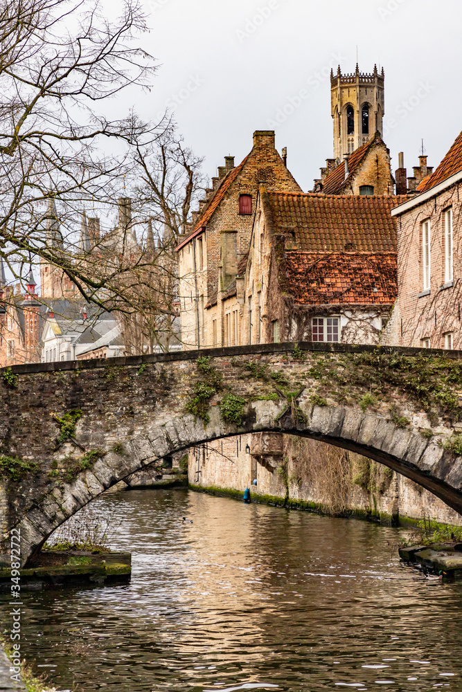 Buildings around channels and bridge in Bruges