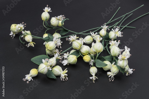 decoration artificial flowers on grey background