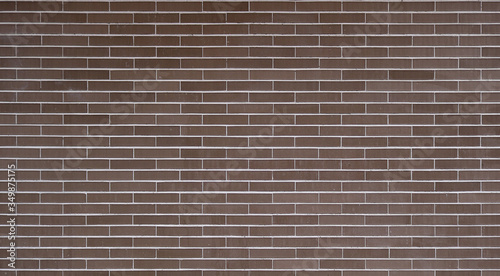 big brick wall with dark brown or garnet color - regular and well aligned bricks background wallpaper 