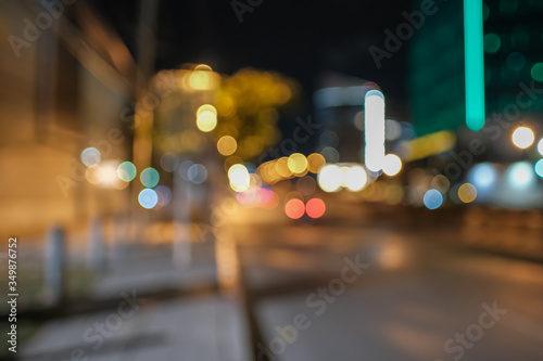 Blurred defocused lights of heavy traffic. Abstract blur image of night light bokeh on street. Blur traffic road with colorful bokeh light. Copy space of transportation and travel concept.