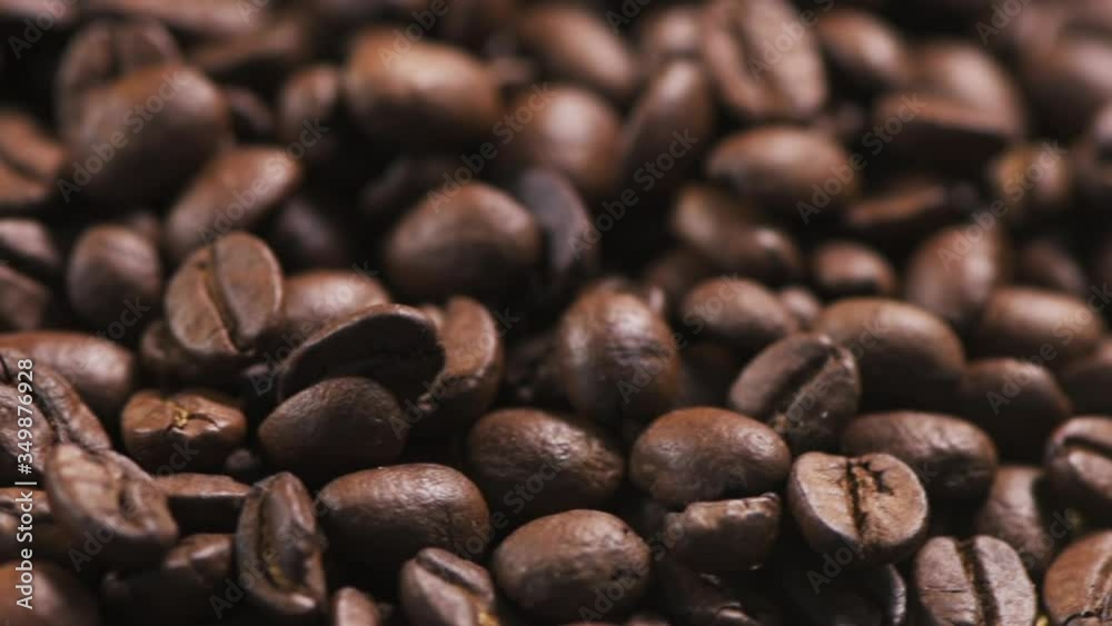 Roasted coffee beans on rotating stand Roasted coffee beans on rotating stand