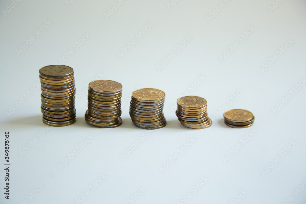 Iron money coins are stacked. Concept of money, stack of money, coins on a white background, Economics and Finance old money.