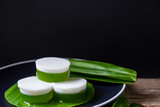 Pandan coconut milk jelly Thai desserts on a plate with serving