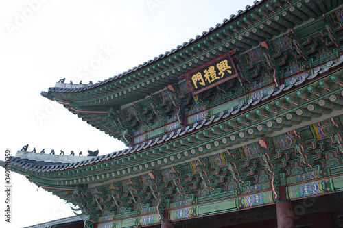It is a historic building in Korea. The writing on it says Heungnyemun. Heungnyemun is located inside Gyeongbokgung Palace.