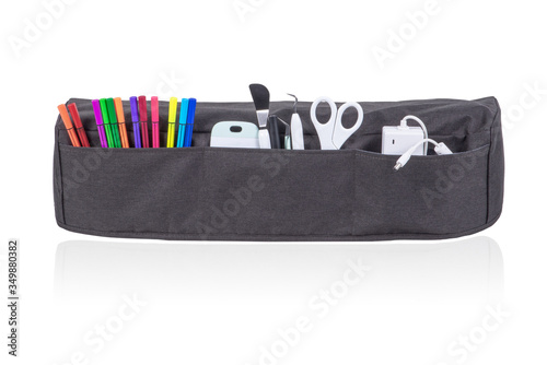 Gray cutting machine cover with all the stationery accessories isolated on white background.