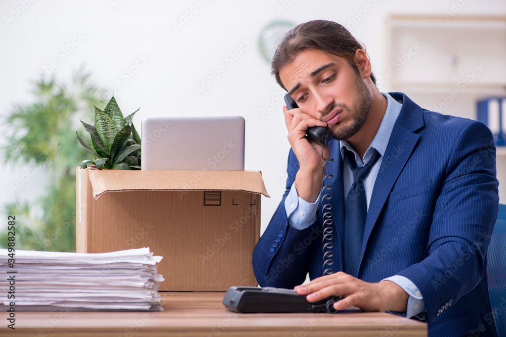 Young man being fired from his work
