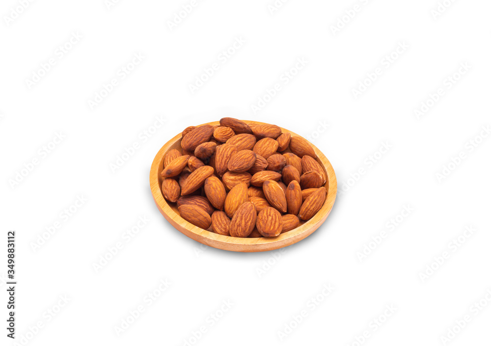 almonds in wooden plate on white background. almonds in wooden plate on white background.