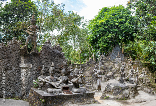 Ancient stone statues in Secret Buddhism Magic Garden, Koh Samui, Thailand. A place for relaxation and meditation. Secret Buddha Garden photo