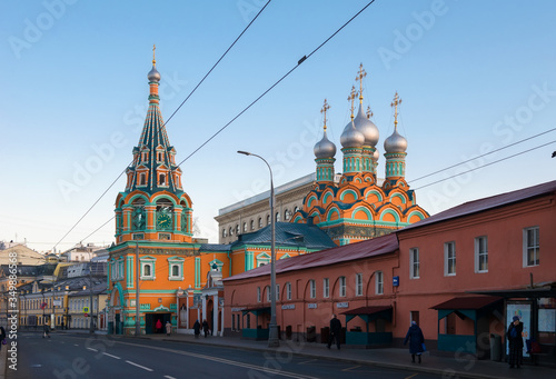 MOSCOW, STREET GREAT POLYANKA 29A, RUSSIA - FEBRUARY 22, 2020: Храм Святителя Григория Неокесарийского  in Darbitz. Bright red green sanctuary in the city center. Old historical building built in 1668 photo