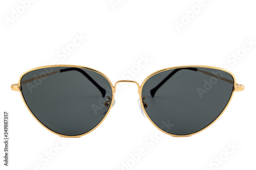 Cat eye sunglasses with black lenses and triangle shaped gold wrap around frames isolated on white background, front view.