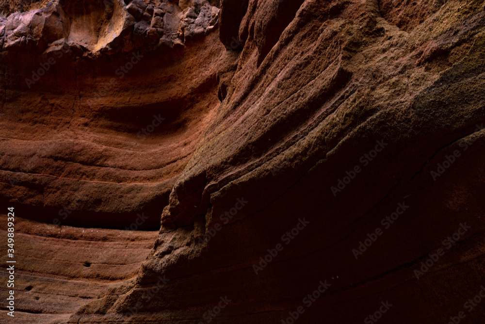ravine with vegetation and beautiful reflections in the natural setting of the Canary Islands with textures on its walls ravine with vegetation and beautiful reflections in the natural setting of the Canary Islands with textures on its walls
