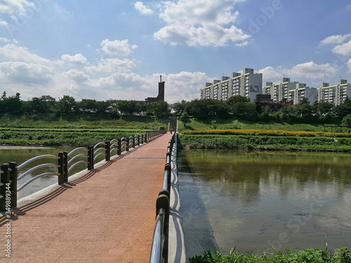 A bridge across a small stream in sunny weather. Gwangmyeong City, South Korea photo