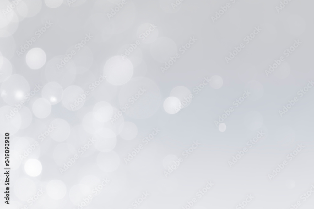 white bokeh defocus glitter blur on gray background. bokeh abstract background.
