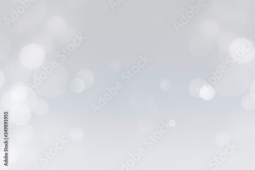white bokeh defocus glitter blur on gray background. bokeh abstract background.