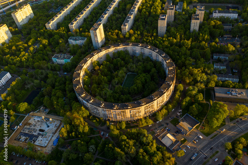 urban landscapes with houses and parks at sunset filmed from a drone