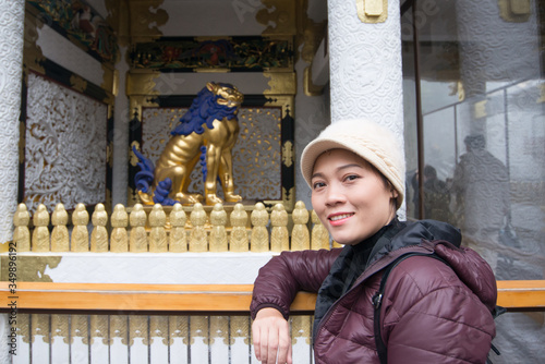 Asian woman visit at beautiful ancient architecture of futarasan Shrine in the World Heritage Nikko,Japan photo