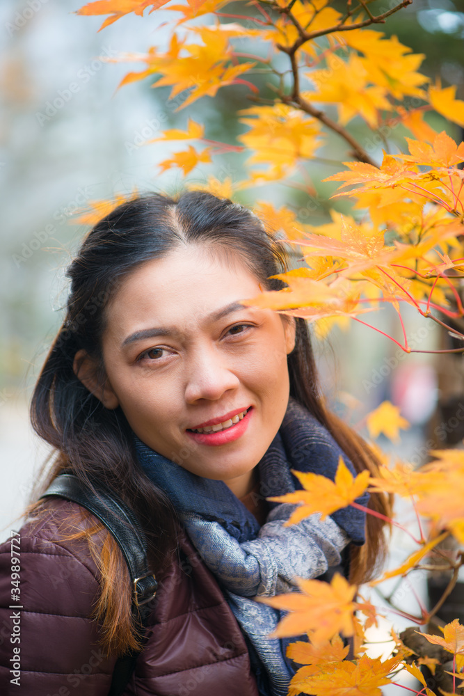 Asian woman and red maple  in autumn of Nikko, Japan