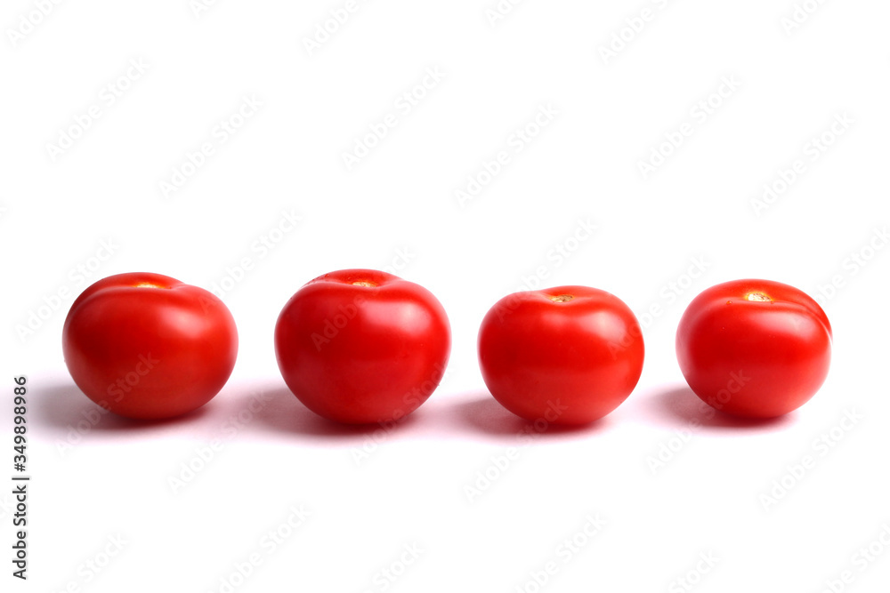 several red tomatoes on the white background, isolated. several red tomatoes on the white background, isolated.