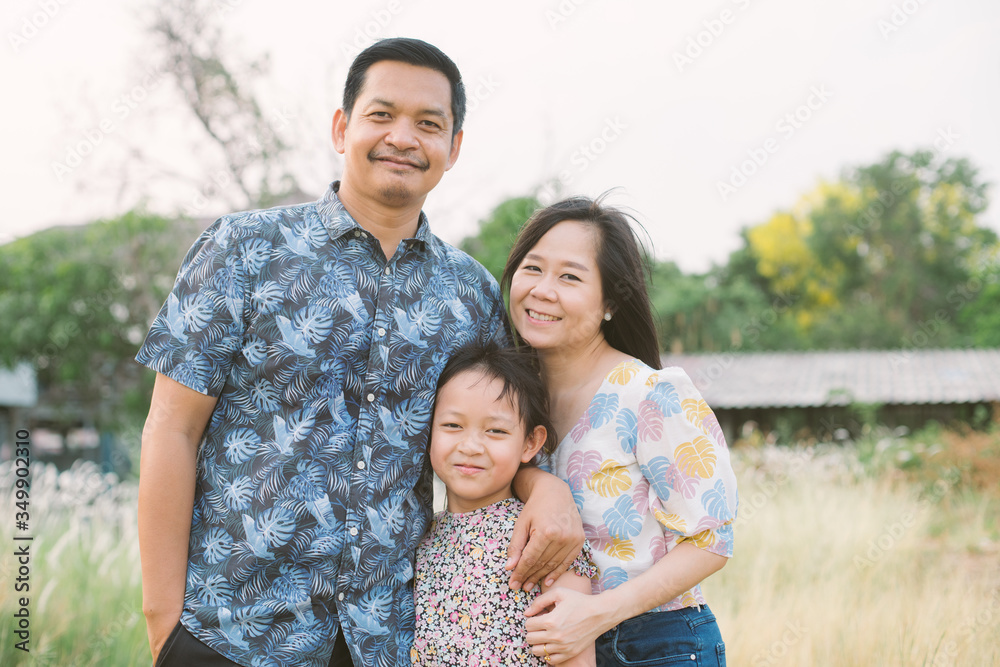 Asian family with father mother and daughter have smiling and happy Asian family with father mother and daughter have smiling and happy