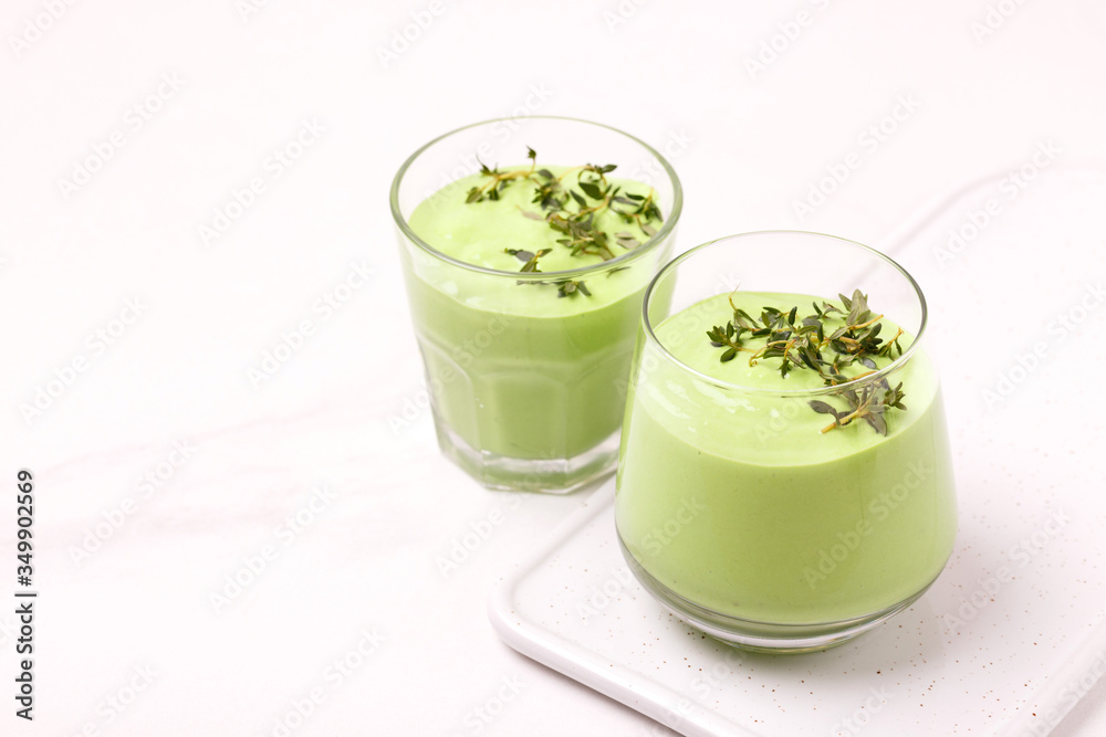 green smoothie with avocado, cucumber, celery and thyme. green smoothie with avocado, cucumber, celery and thyme.