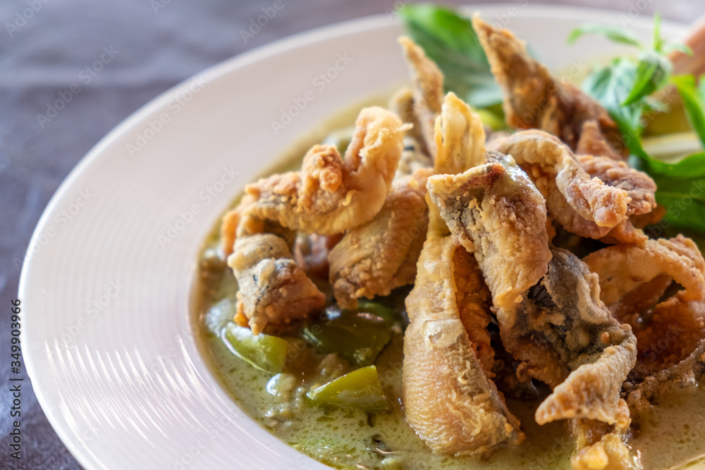 Green curry with chicken and crispy fried fish skin Green curry with chicken and crispy fried fish skin
