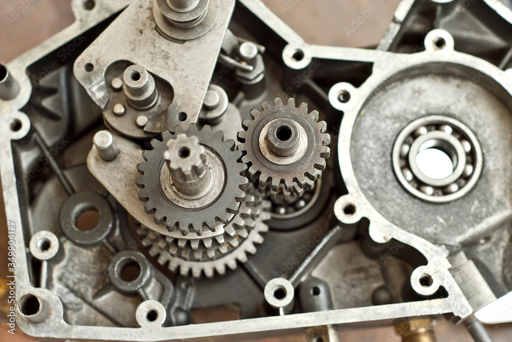 Disassembled engine from a motorcycle close up. Repair and maintenance of old spare parts. Disassembled engine from a motorcycle close up. Repair and maintenance of old spare parts.