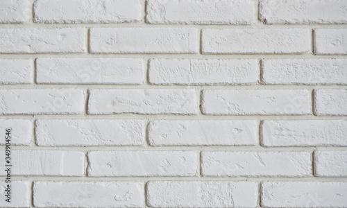 Fragment of a white brick wall
