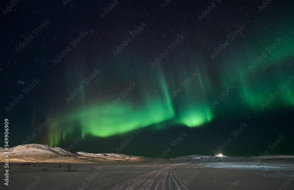 Landscape with northern lights  on the coast of the Barents Sea on the Kola Peninsula at night at high ISO sensitivity