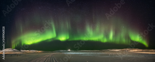 Landscape with northern lights  on the coast of the Barents Sea on the Kola Peninsula at night at high ISO sensitivity. Panoramic view