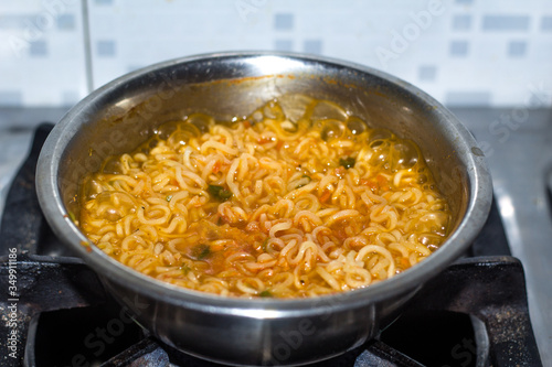 Cook Famous home made asian instant noodle in a porcelain bowl . Close up photo